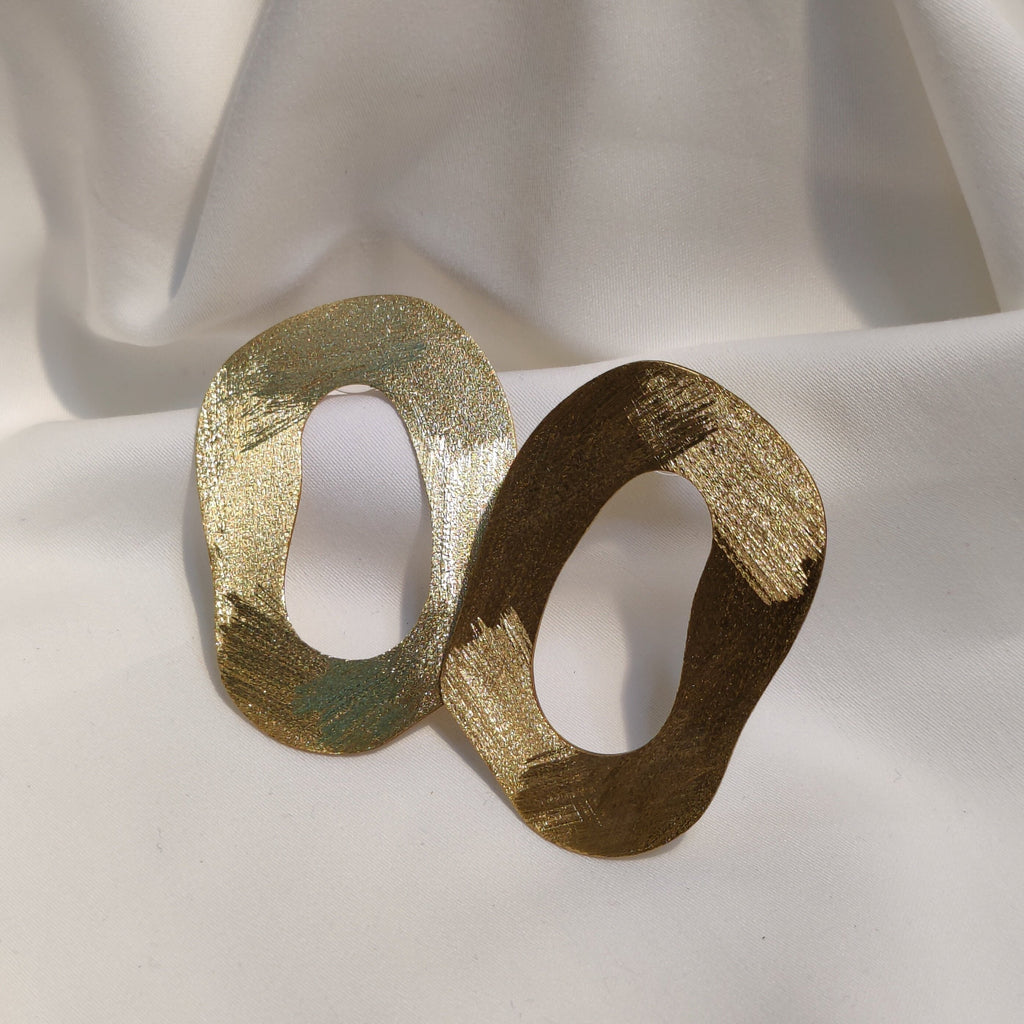 Handmade gold plated brass wavy circle earrings. 