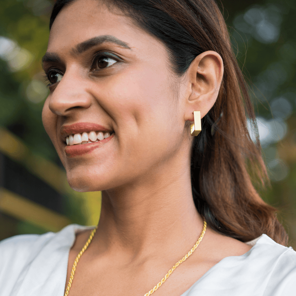 Model wearing Gold plated brass earrings
