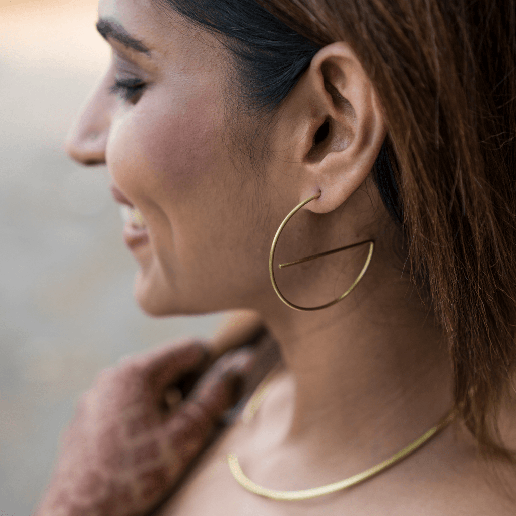 Model wearing Handmade gold plated brass earrings